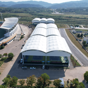 Stadium shade structures covering outdoor sports courts